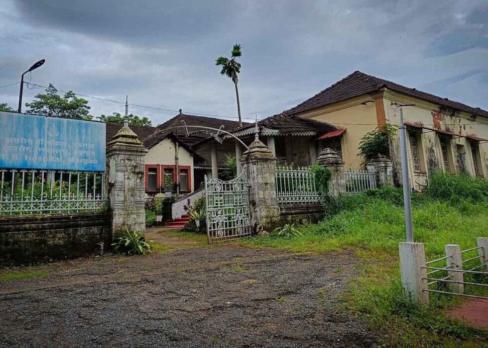 The image shows the exterior of the Government TB Hospital in Margao, showcasing its distinct Portuguese-era architecture and historical design.